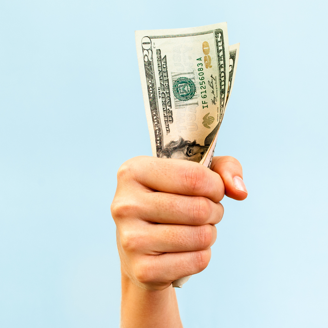 Hand holding cash